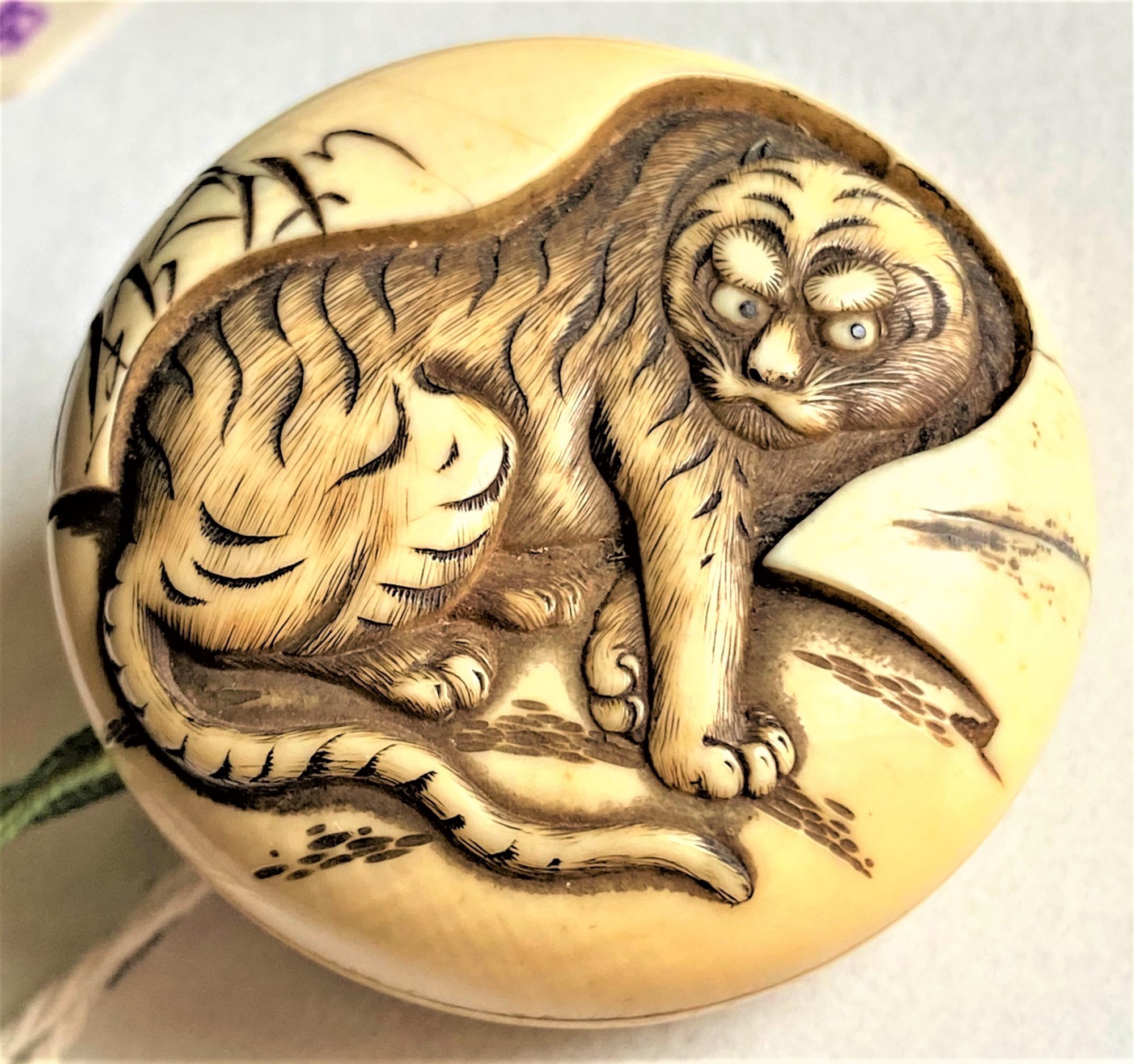 1 of several netsuke in the auction button