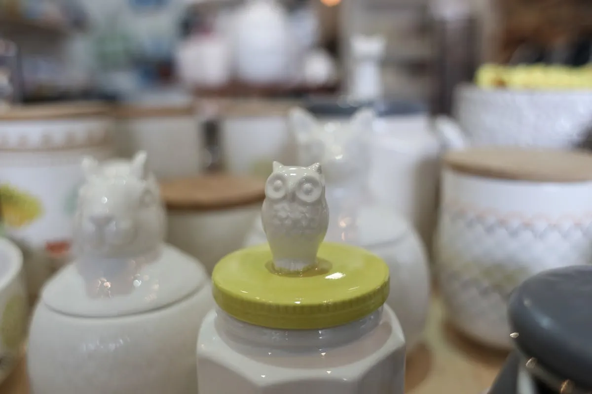White ceramic owl figurine representing collectible porcelain antiques