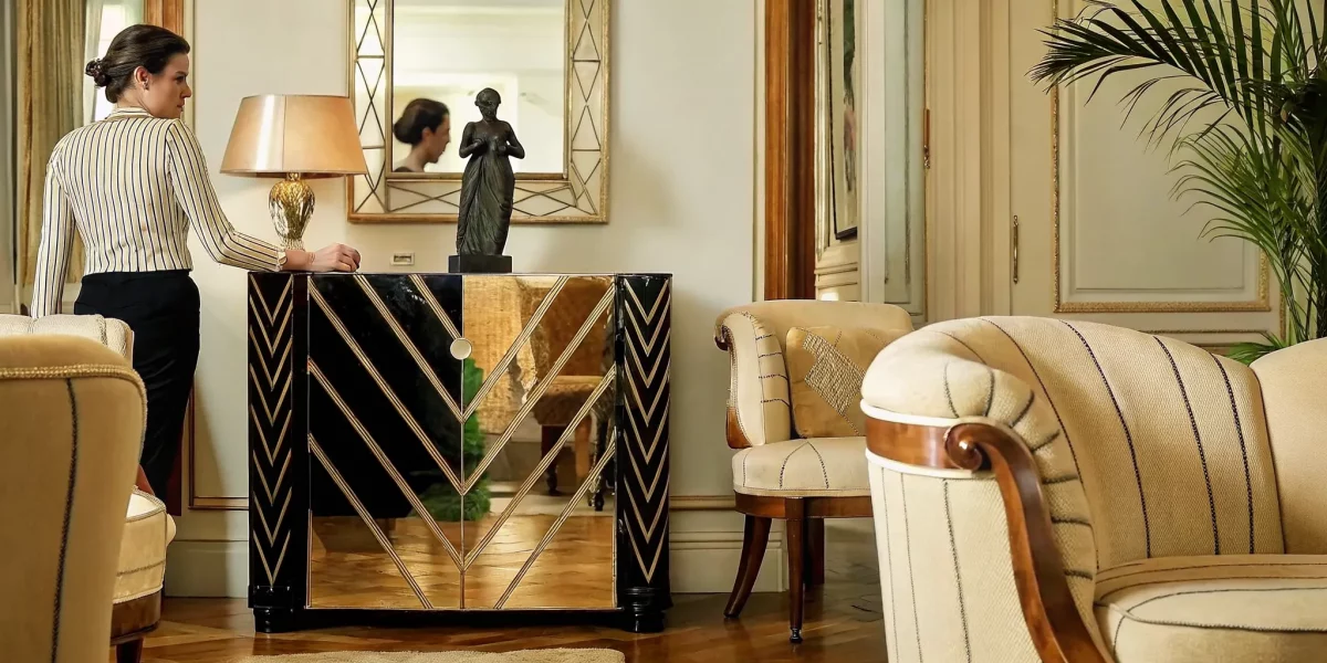 Art Deco cabinet, bronze lamp, and decorative arts in an elegant interior